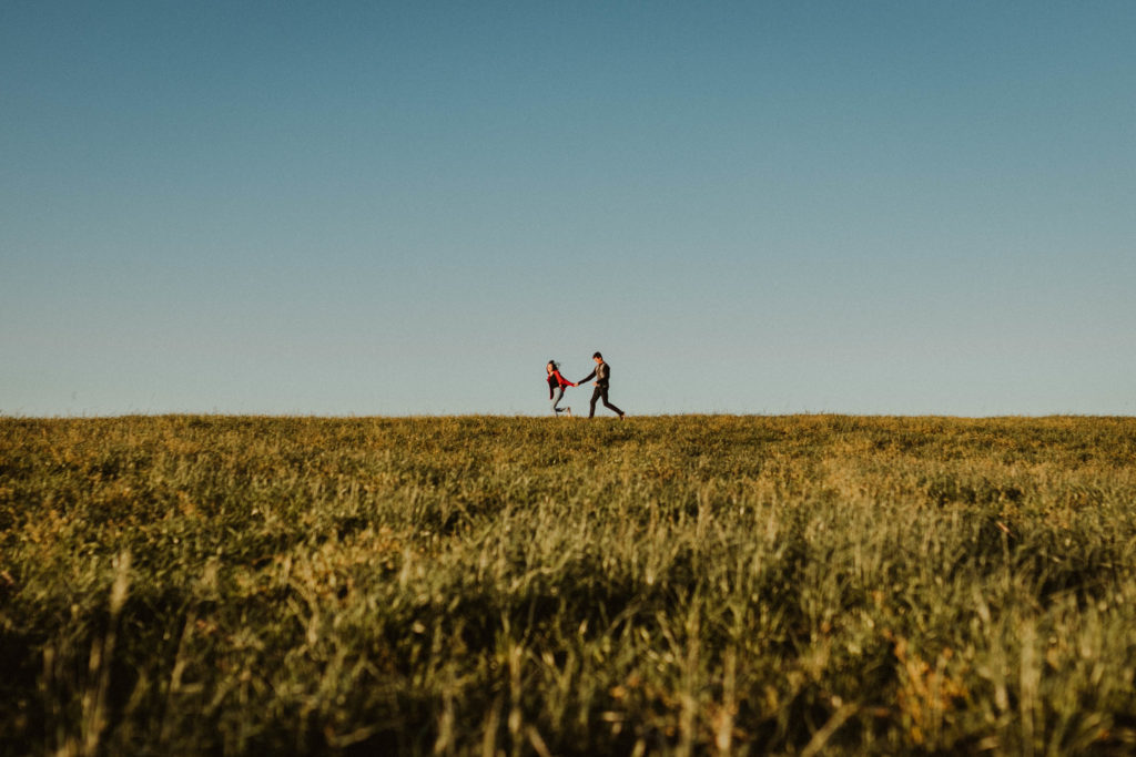 People running across and open green field